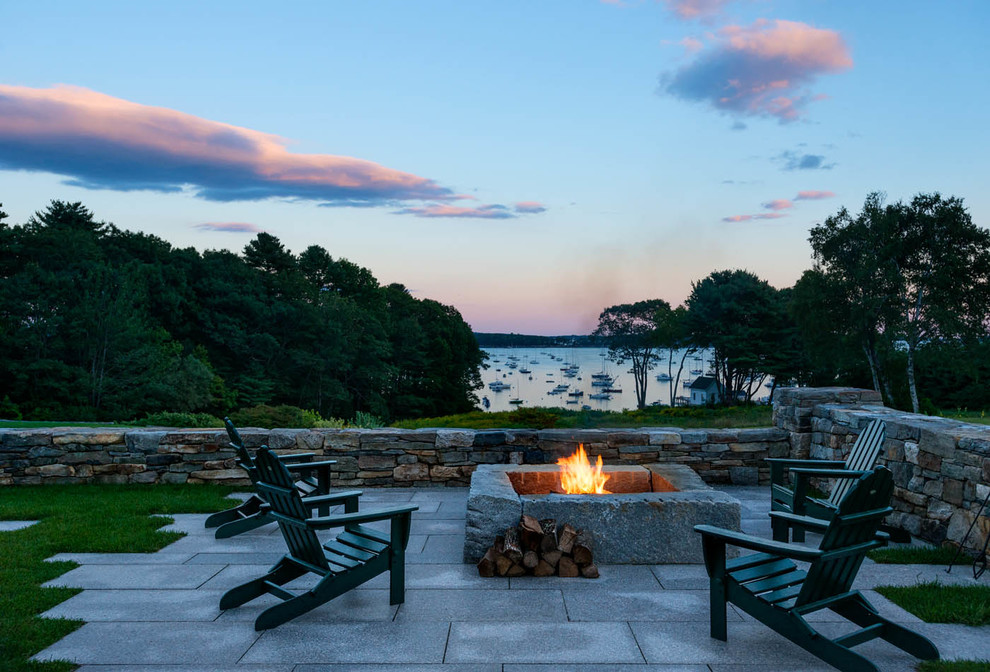Design ideas for a beach style patio in Portland Maine with a fire feature.