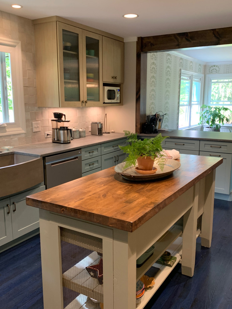 This is an example of a mid-sized transitional galley eat-in kitchen with a farmhouse sink, recessed-panel cabinets, blue cabinets, quartz benchtops, grey splashback, ceramic splashback, coloured appliances, painted wood floors, with island and blue floor.