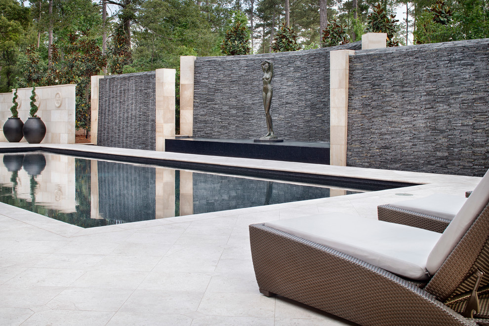 Pool fountain - huge transitional backyard pool fountain idea in Houston