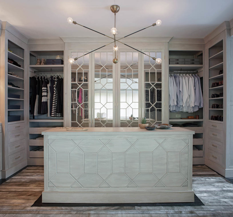This is an example of a transitional gender-neutral dressing room in Atlanta with open cabinets.