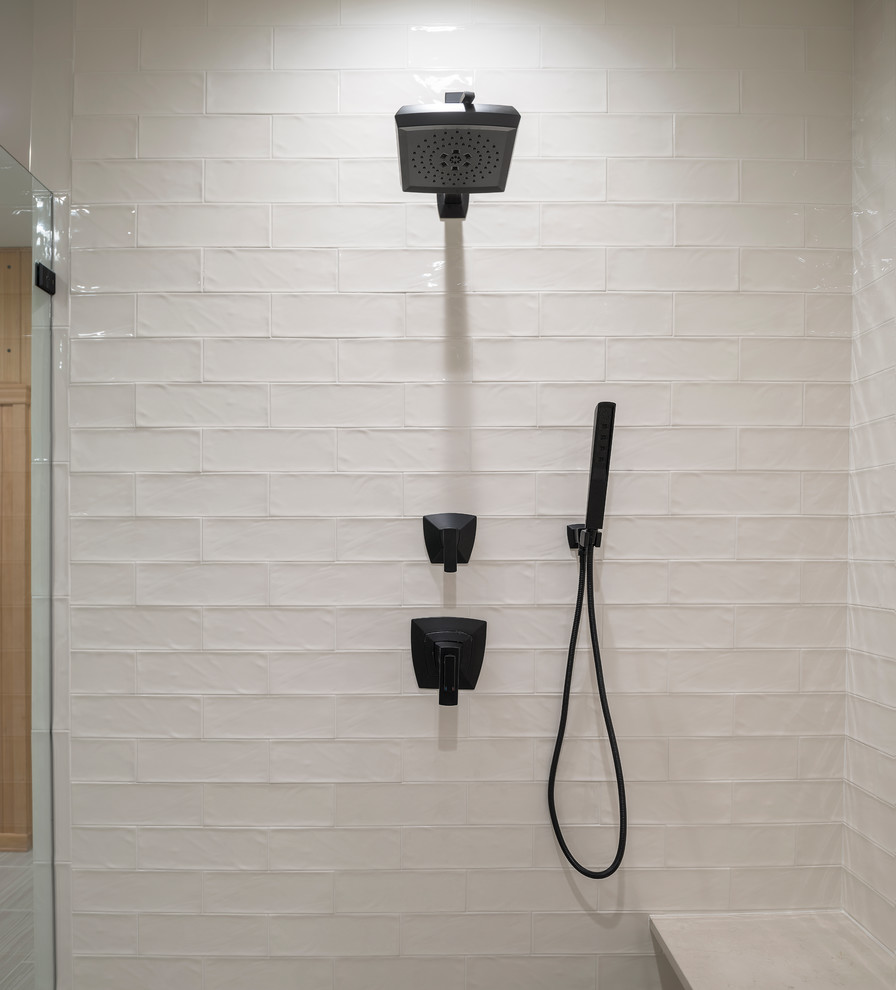 Walk-in shower - transitional beige tile porcelain tile and beige floor walk-in shower idea in DC Metro with an undermount tub, beige walls, quartz countertops and beige countertops