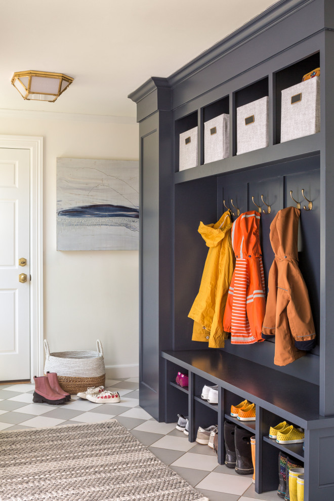 Inspiration for a mid-sized traditional mudroom in Portland Maine with blue walls and grey floor.
