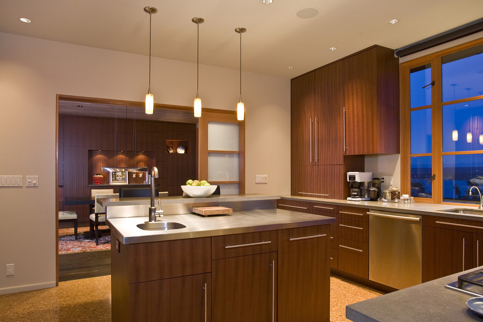 Contemporary l-shaped separate kitchen in Seattle with with island, an undermount sink, flat-panel cabinets, dark wood cabinets, concrete benchtops, stainless steel appliances and cork floors.