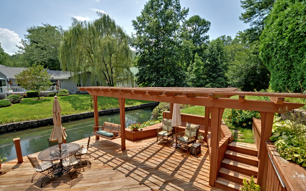 Design ideas for a country deck in Atlanta with a pergola.