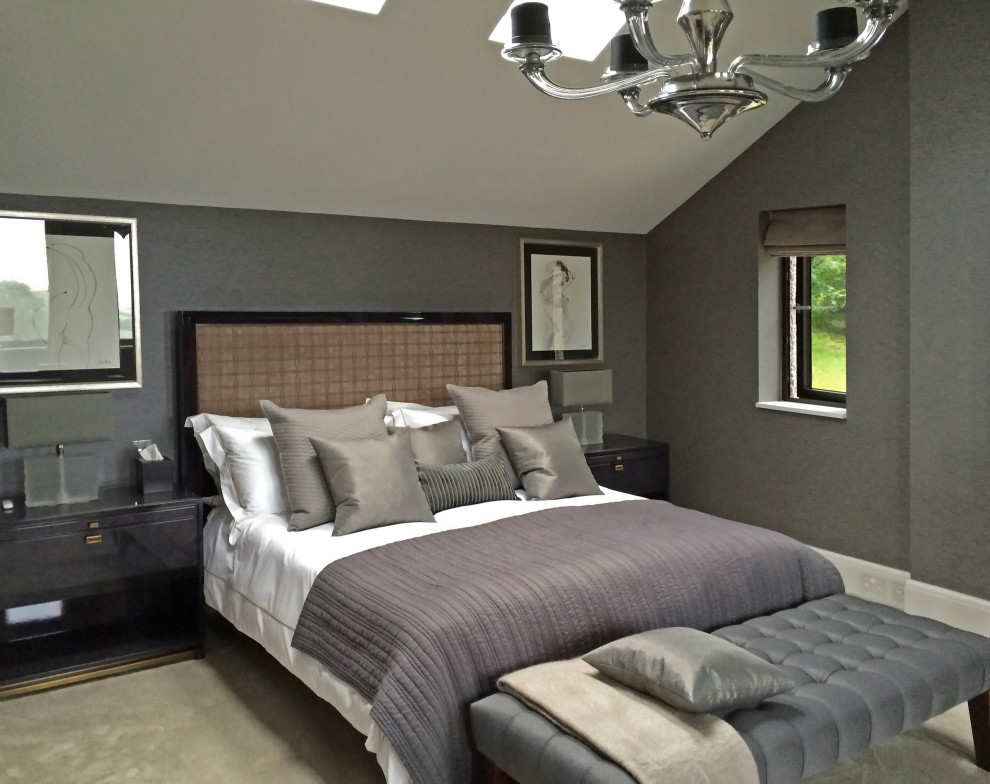 Photo of a large arts and crafts master bedroom in Cornwall with grey walls, carpet, beige floor and wallpaper.