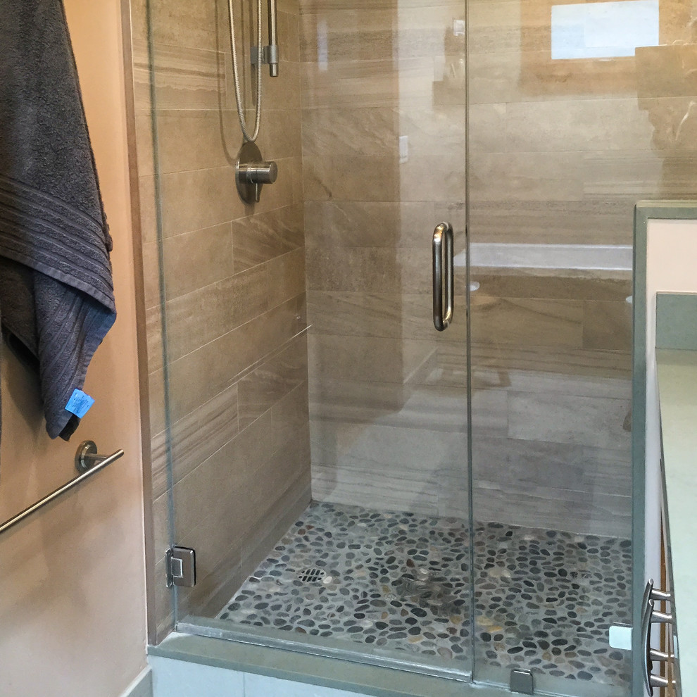Example of a mid-sized transitional master gray tile and porcelain tile cement tile floor and gray floor drop-in bathtub design with recessed-panel cabinets, dark wood cabinets, beige walls, an undermount sink, quartz countertops and a hinged shower door