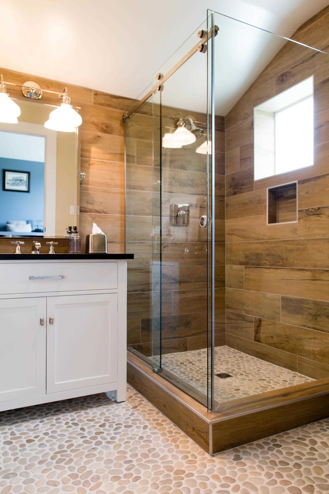 Design ideas for a mid-sized beach style master bathroom in San Luis Obispo with furniture-like cabinets, white cabinets, a corner shower, brown tile, ceramic tile, brown walls, mosaic tile floors, a drop-in sink, laminate benchtops, beige floor and a sliding shower screen.