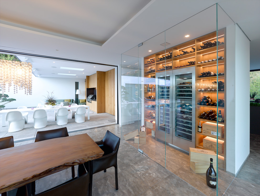Inspiration for a large contemporary wine cellar in Stuttgart with storage racks and grey floor.
