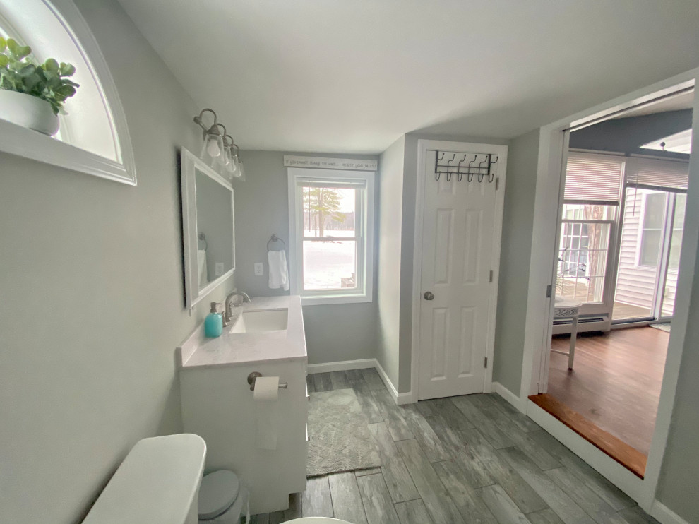 Design ideas for a mid-sized traditional bathroom in Boston with grey walls and ceramic floors.