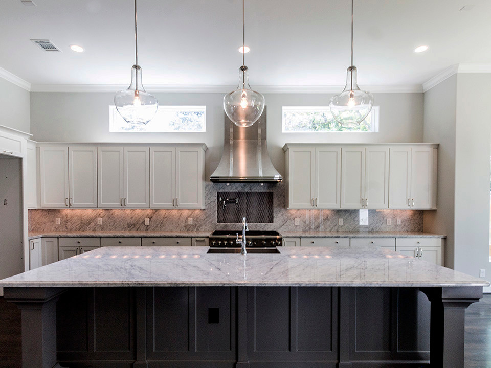 Example of a large transitional dark wood floor open concept kitchen design in Houston with a farmhouse sink, shaker cabinets, white cabinets, marble countertops, stone slab backsplash, stainless steel appliances and an island