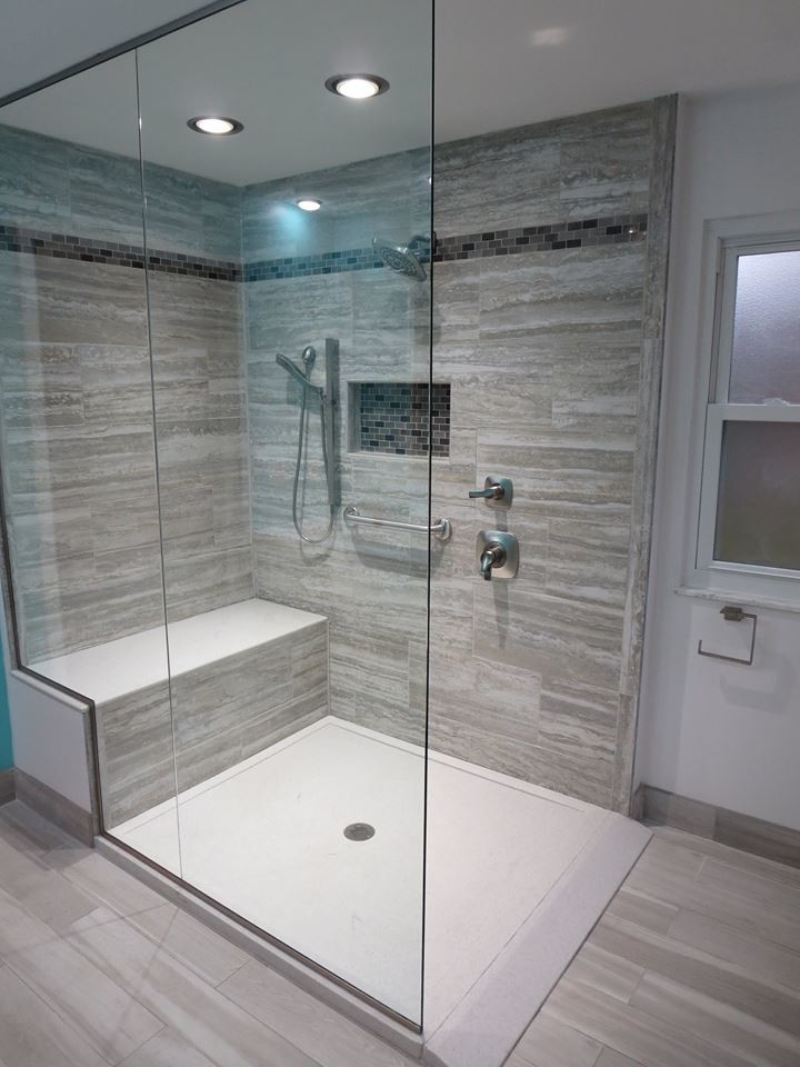 Mid-sized modern master bathroom in Columbus with flat-panel cabinets, light wood cabinets, a curbless shower, a two-piece toilet, gray tile, porcelain tile, blue walls, porcelain floors, an undermount sink and engineered quartz benchtops.