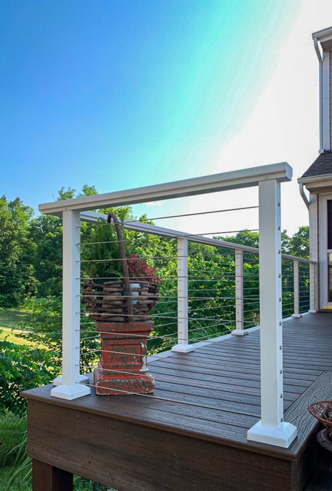 Inspiration for a large classic back first floor wire cable railing terrace in Kansas City with no cover.