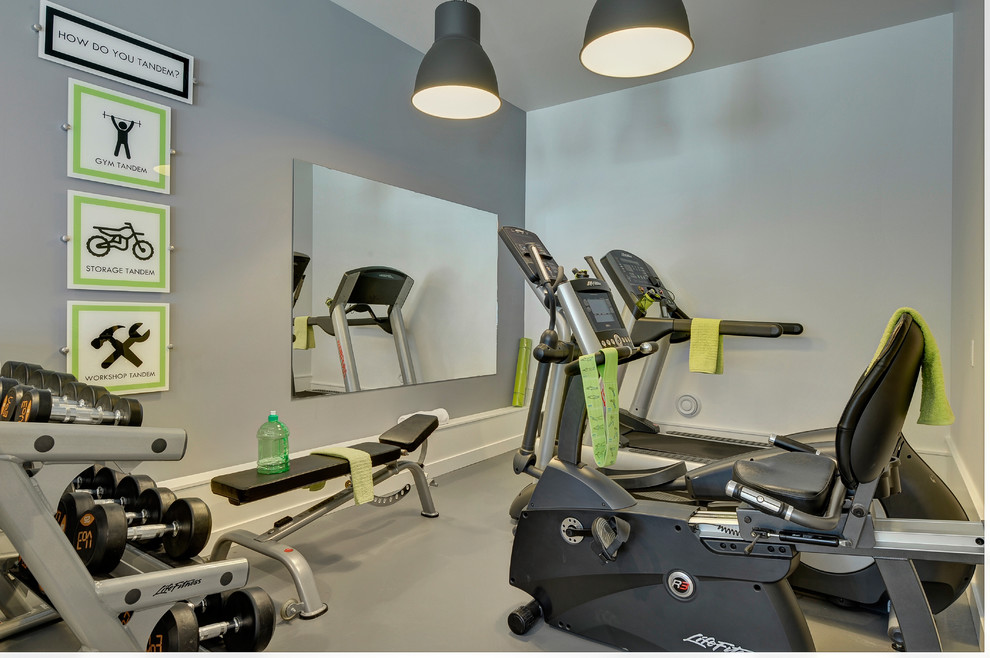 Design ideas for a large transitional home gym in Edmonton.