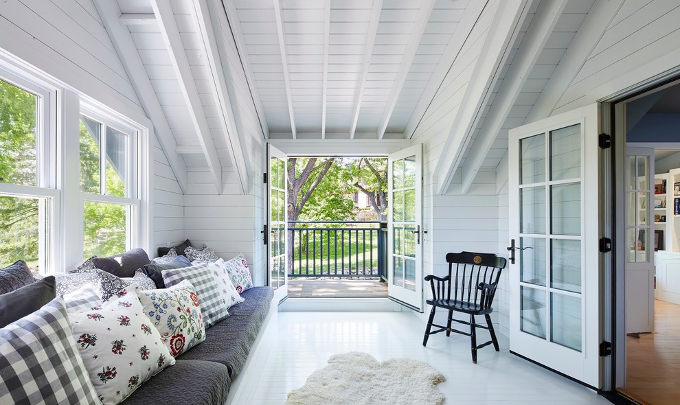 Photo of a mid-sized scandinavian backyard verandah in Minneapolis with a roof extension.