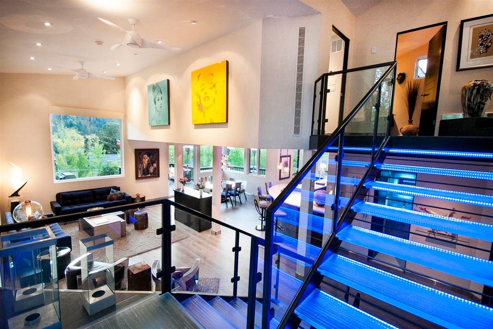 This is an example of a mid-sized contemporary glass floating staircase in Denver with open risers.