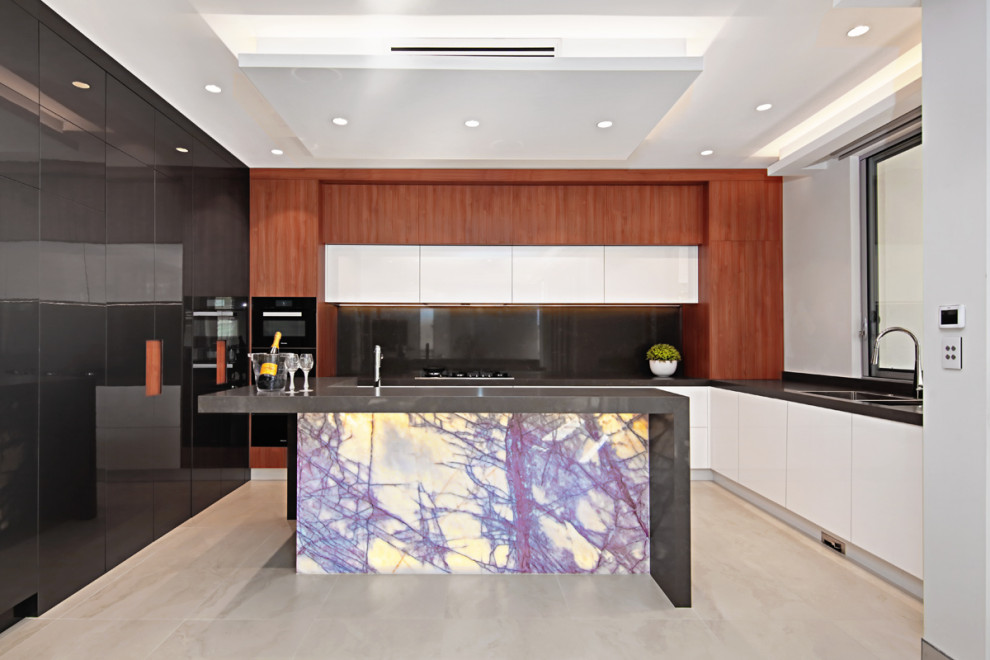 Design ideas for a mid-sized modern u-shaped open plan kitchen in Sydney with a double-bowl sink, recessed-panel cabinets, dark wood cabinets, marble benchtops, black splashback, marble splashback, black appliances, ceramic floors, with island, beige floor, black benchtop and coffered.