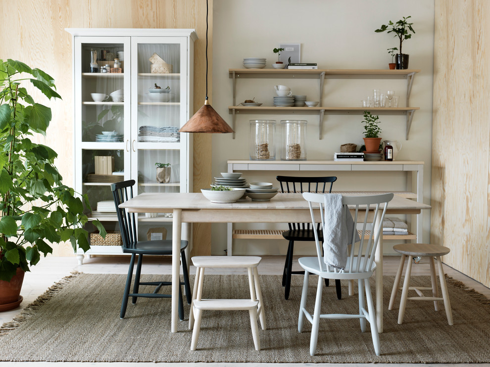 Design ideas for a mid-sized scandinavian dining room in Malmo with white walls and light hardwood floors.