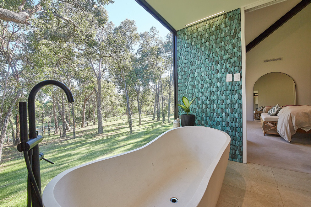 Large contemporary master bathroom in Perth with furniture-like cabinets, medium wood cabinets, a freestanding tub, a double shower, a one-piece toilet, beige tile, porcelain tile, white walls, porcelain floors, a vessel sink, wood benchtops, beige floor, an open shower, a niche, a double vanity and a floating vanity.