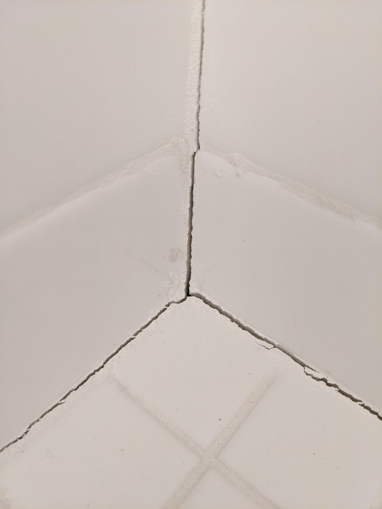 Large settlement(?) cracks in shower floor, new house.