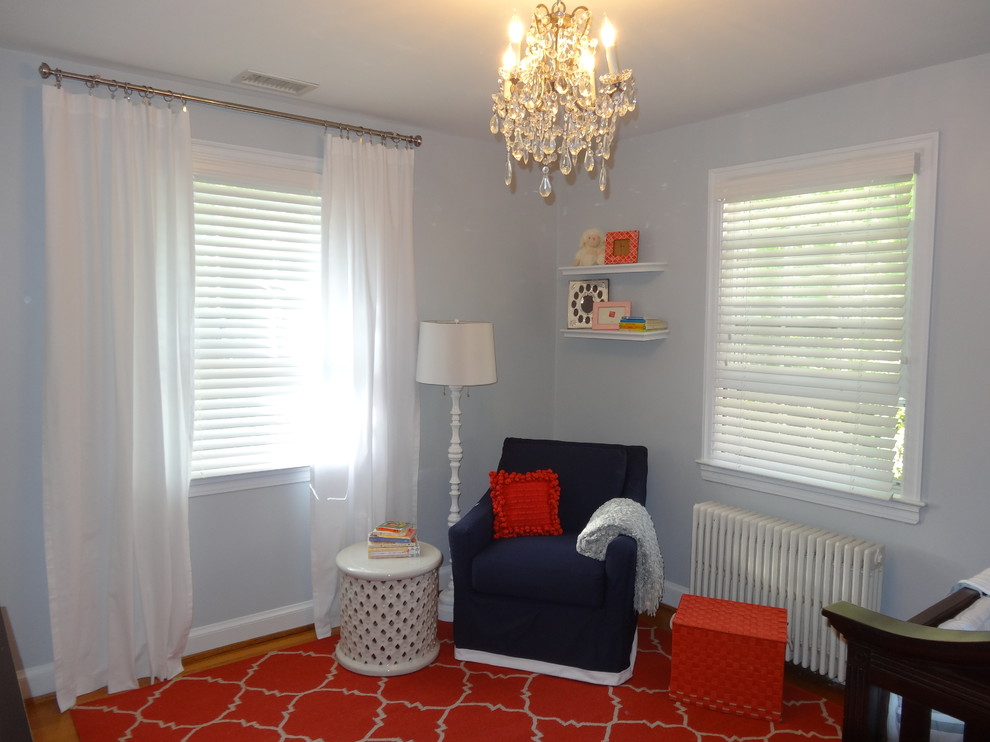 Photo of a small modern kids' bedroom for girls in DC Metro with grey walls and light hardwood floors.