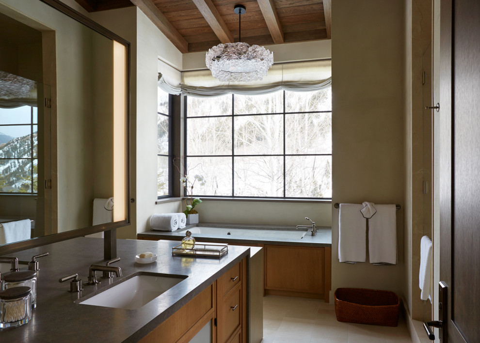Photo of a country master bathroom in Other with recessed-panel cabinets, medium wood cabinets, beige walls, an undermount sink, beige floor, grey benchtops, a built-in vanity, exposed beam, vaulted and wood.