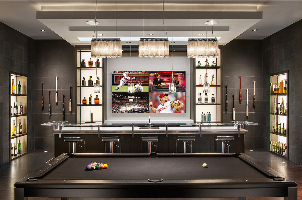 This is an example of a contemporary home bar in Phoenix with dark hardwood floors and white benchtop.