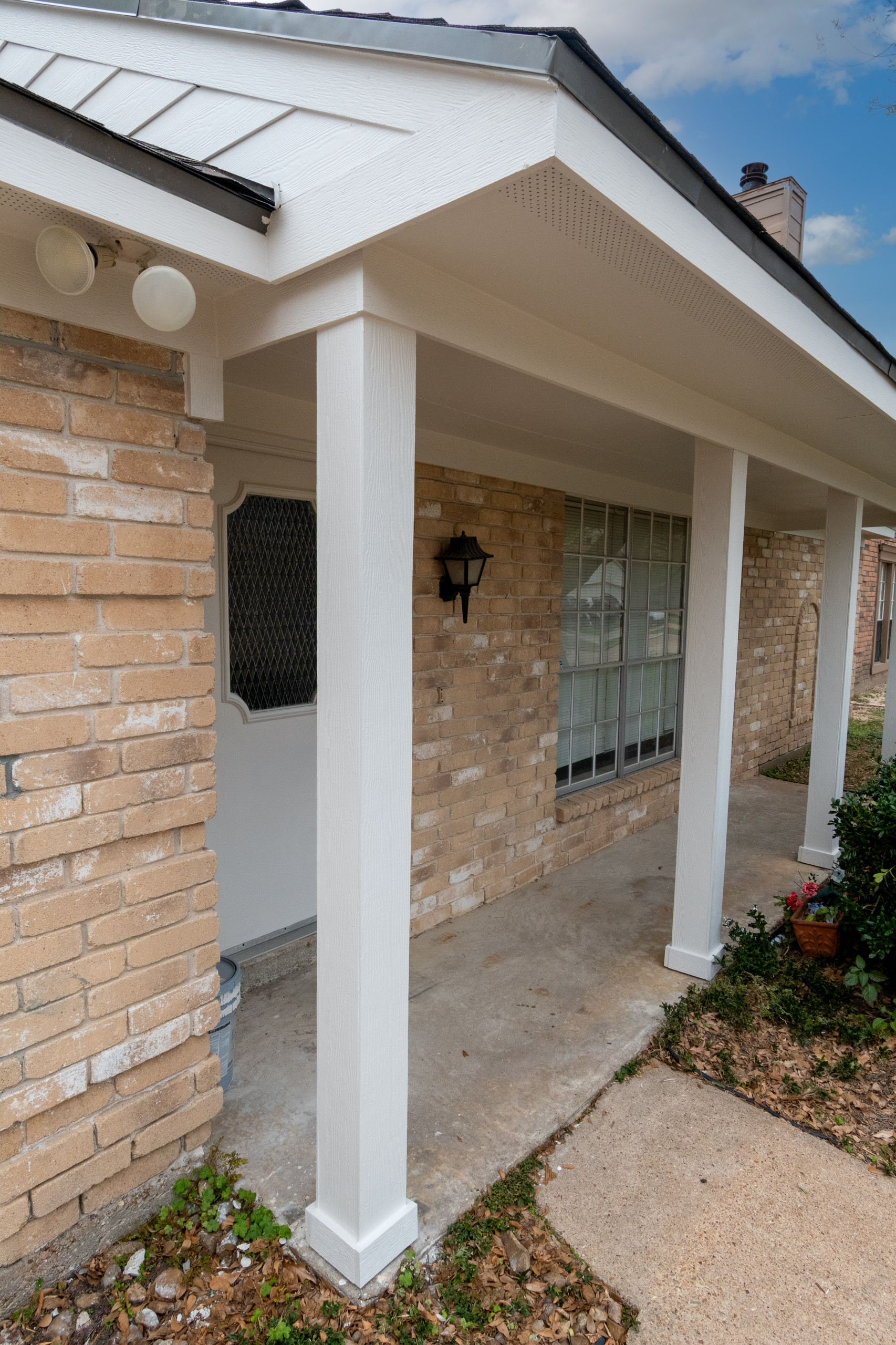 Brick Home Refresh with Hardie Siding, Fascia, Soffit, and Modern Column Replace