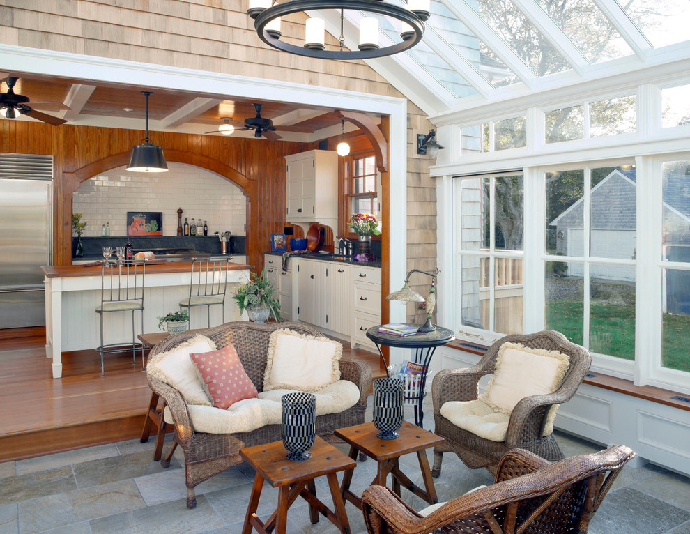 Design ideas for a traditional sunroom in Providence with a glass ceiling and grey floor.