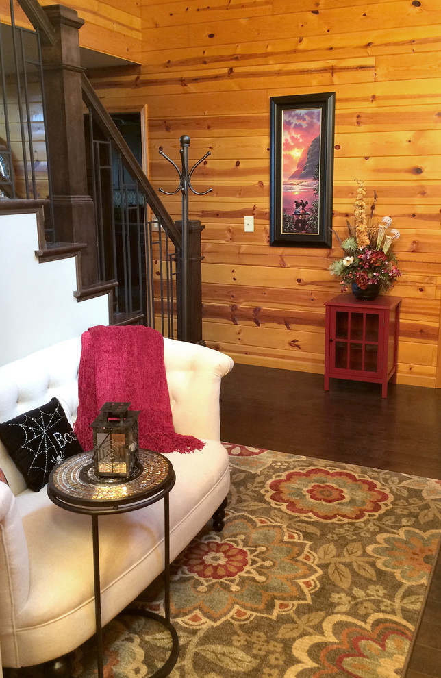 Inspiration for a mid-sized transitional dark wood floor foyer remodel with gray walls
