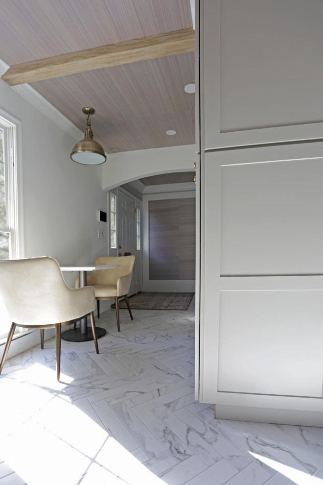 Mid-sized transitional l-shaped marble floor, white floor and exposed beam kitchen photo in DC Metro with an undermount sink, shaker cabinets, white cabinets, quartzite countertops, white backsplash, quartz backsplash and stainless steel appliances