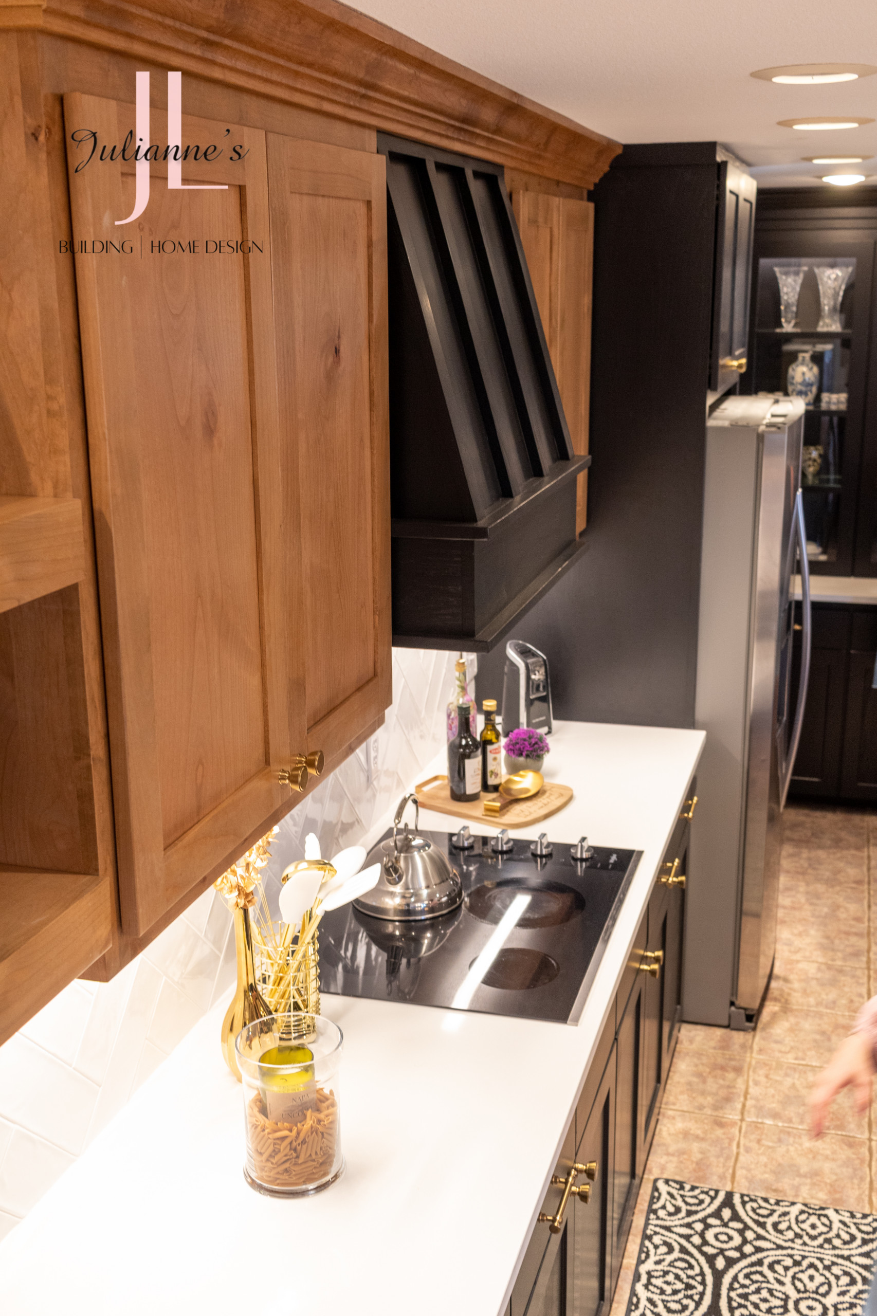 A modern, updated vent hood, gives this kitchen a high-end look.