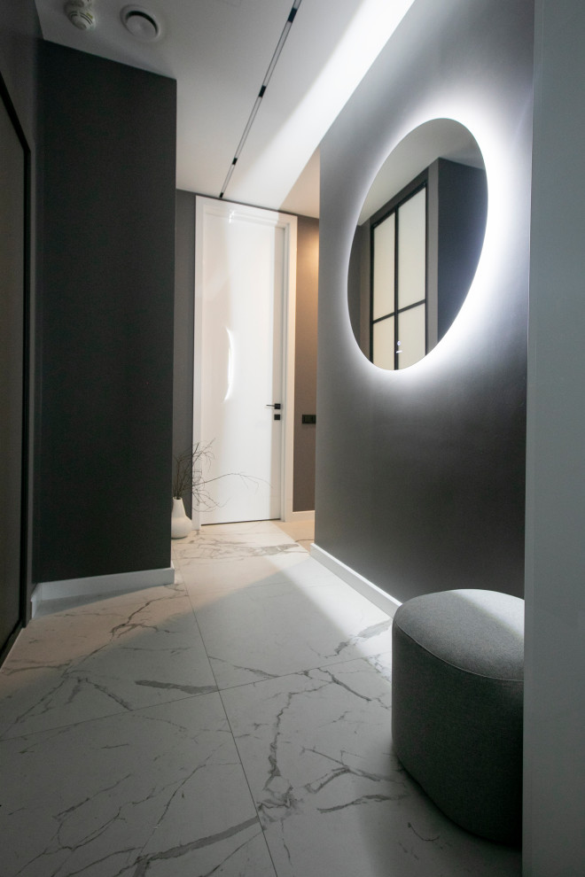 Photo of a contemporary hallway in Moscow with grey walls, porcelain floors and white floor.