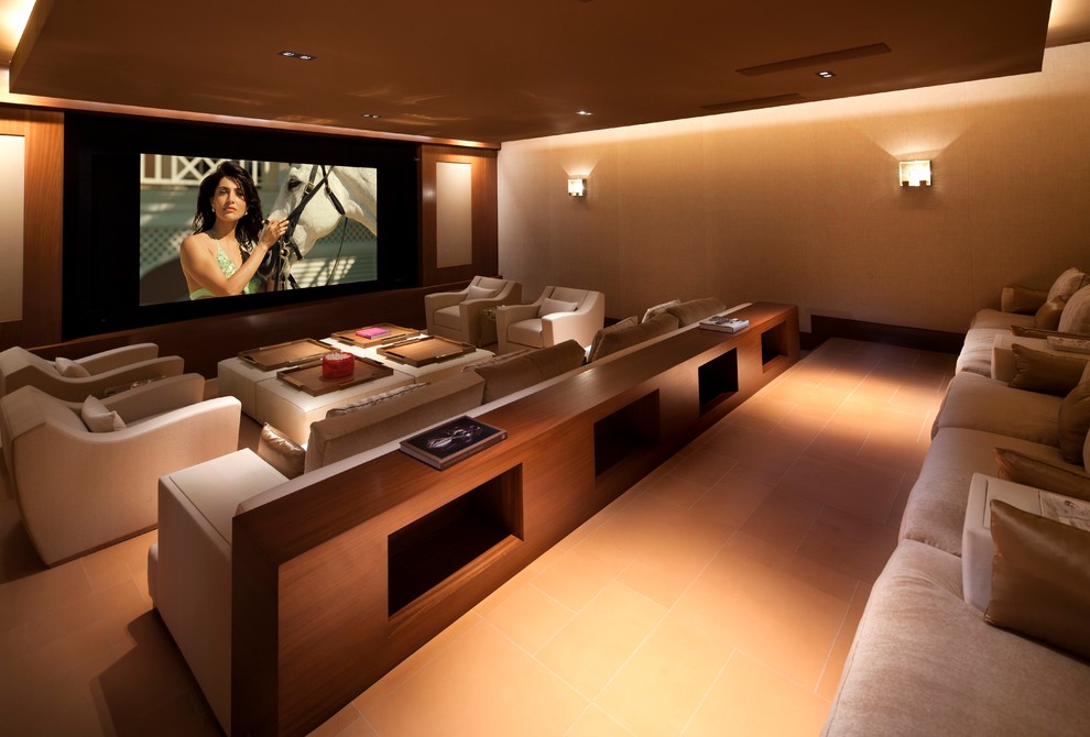Design ideas for a contemporary home theatre in Orange County with beige walls, a wall-mounted tv and orange floor.