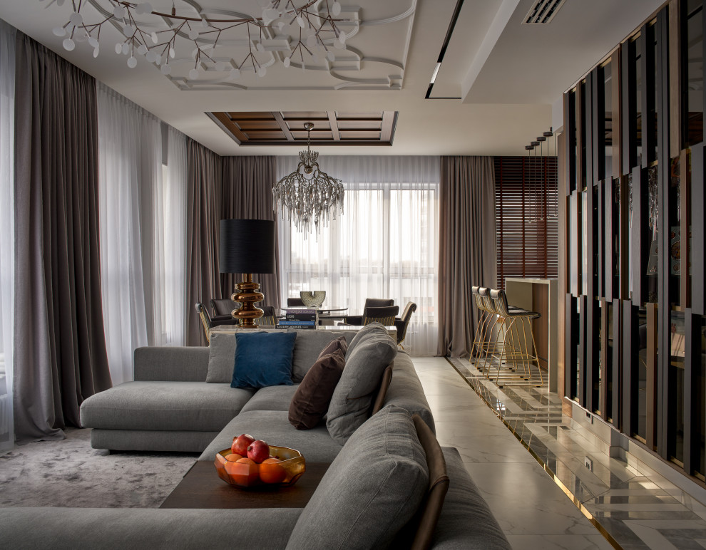This is an example of a large contemporary formal living room in Yekaterinburg with grey walls, porcelain floors, no fireplace, a freestanding tv, grey floor, coffered and panelled walls.