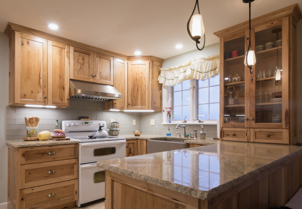 Kitchen - rustic ceramic tile and beige floor kitchen idea in Boston with a farmhouse sink, shaker cabinets, light wood cabinets, granite countertops, gray backsplash, subway tile backsplash and stainless steel appliances