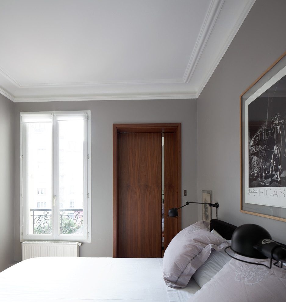 Photo of a small contemporary master bedroom in Paris.