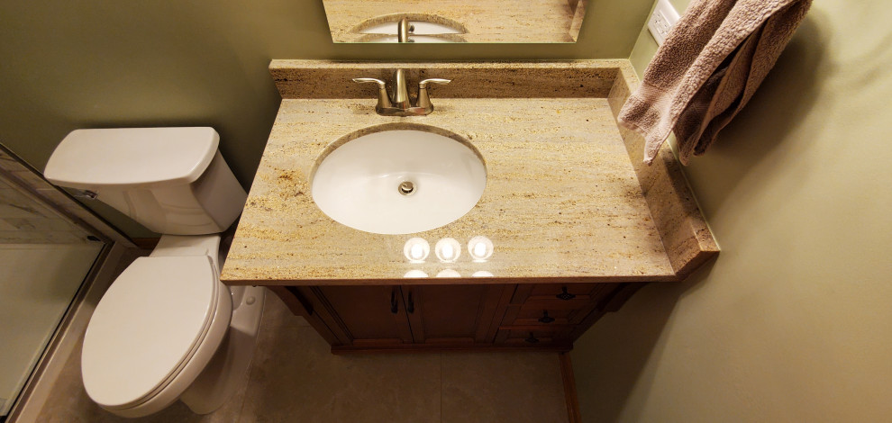 Finished basement bathroom with custom offset vanity top