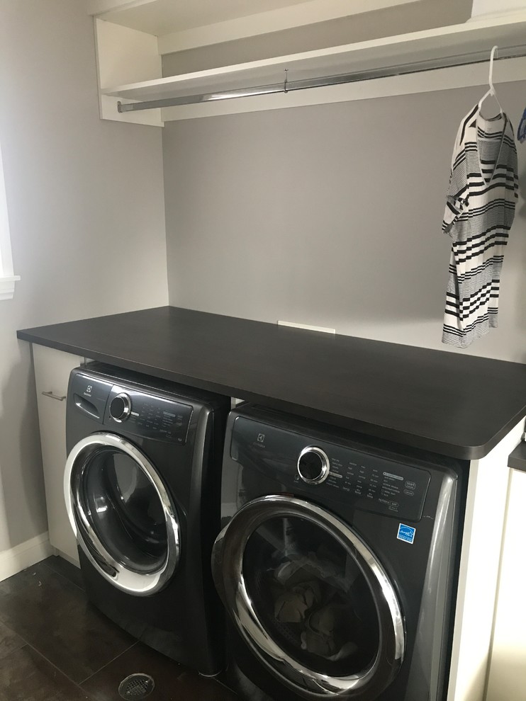 This is an example of a large transitional laundry room in Denver.