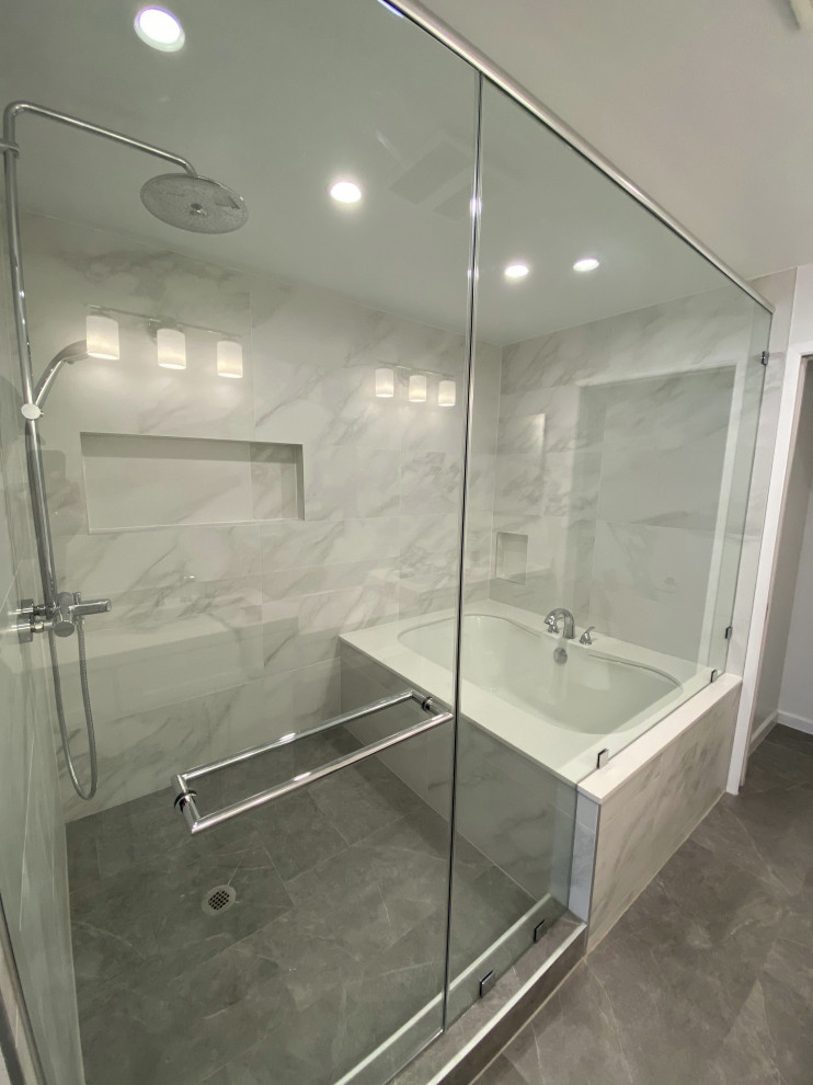 Wet room - large scandinavian master white tile and ceramic tile ceramic tile and gray floor wet room idea in Los Angeles with an undermount tub, white walls, a hinged shower door and a niche