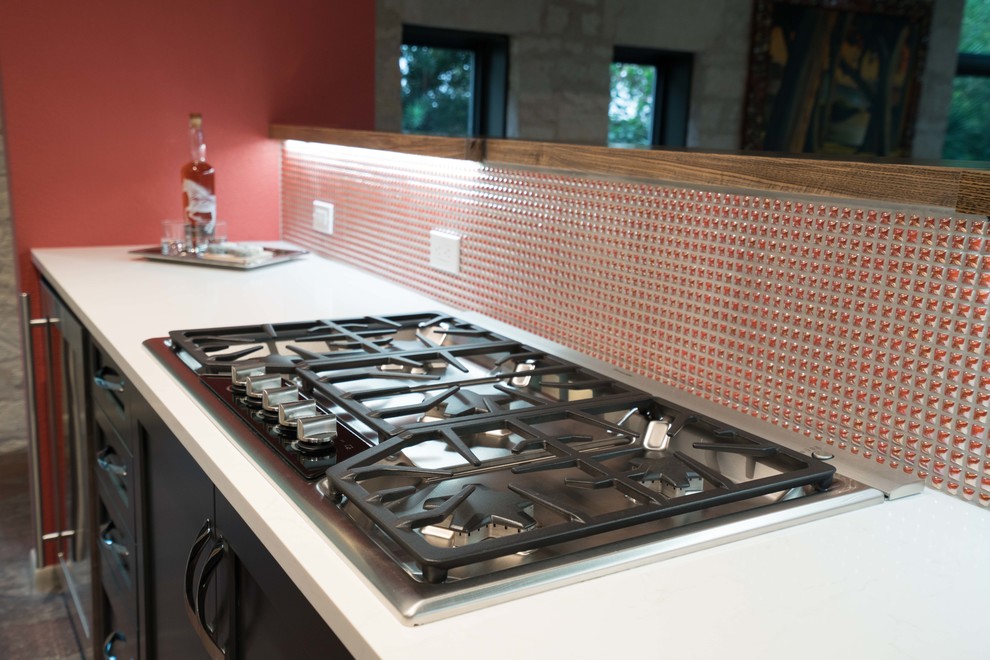 Inspiration for a mid-sized transitional kitchen remodel in Austin with flat-panel cabinets