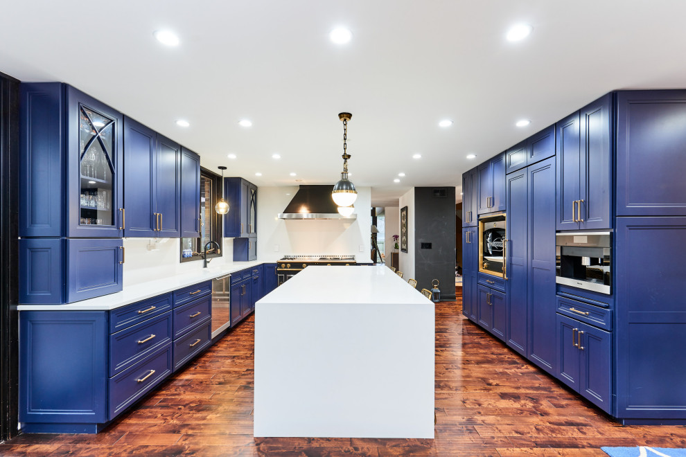Symmetrical Navy Kitchen With Oversized Island