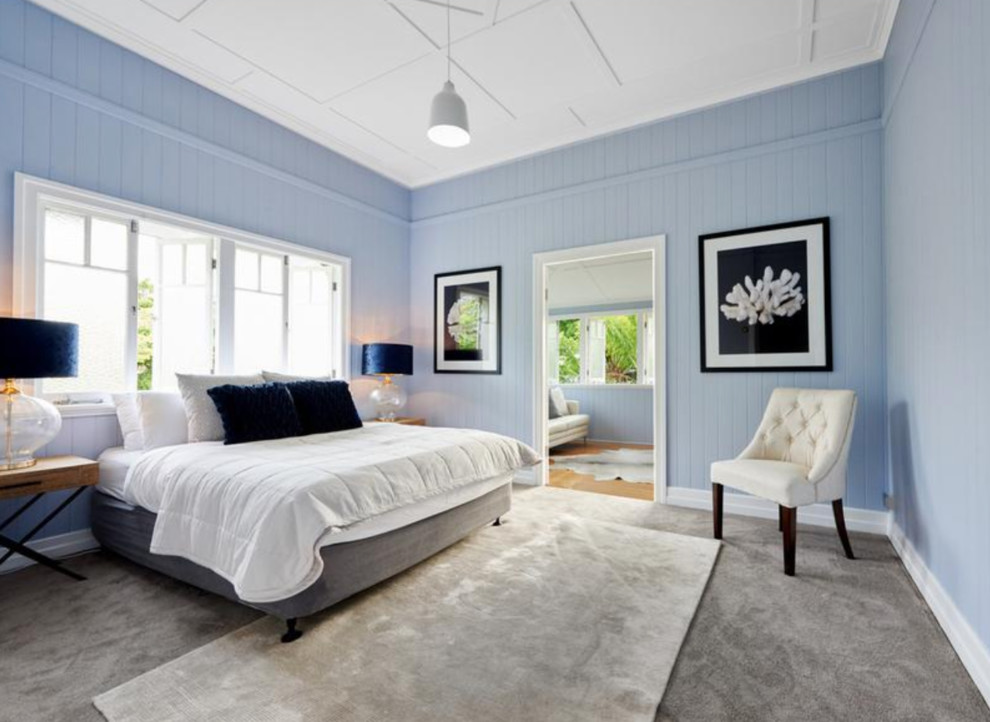This is an example of a contemporary master bedroom in Brisbane with grey walls, carpet and grey floor.