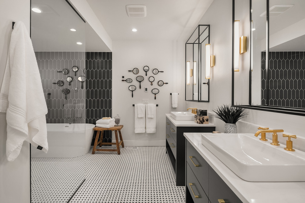 Expansive country master wet room bathroom in Seattle with flat-panel cabinets, black cabinets, a freestanding tub, black tile, white walls, a vessel sink, multi-coloured floor and white benchtops.