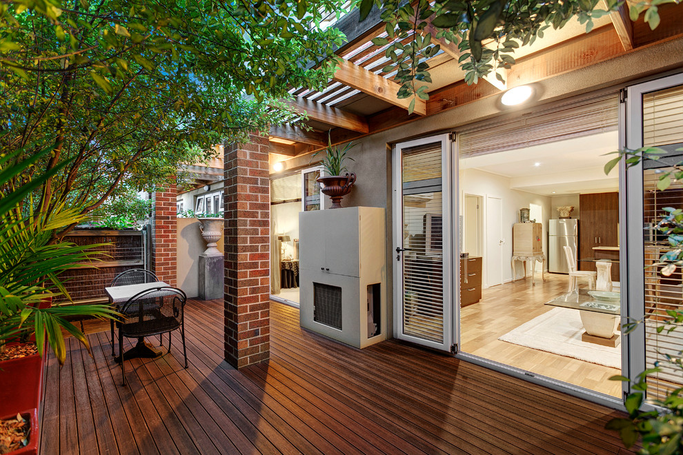 Photo of a mid-sized country rooftop deck in Melbourne with a pergola.