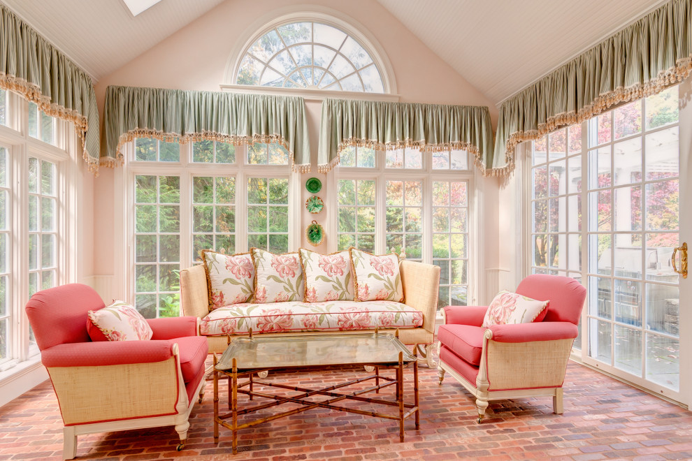 Photo of a large traditional sunroom in Boston with brick floors, a skylight and red floor.