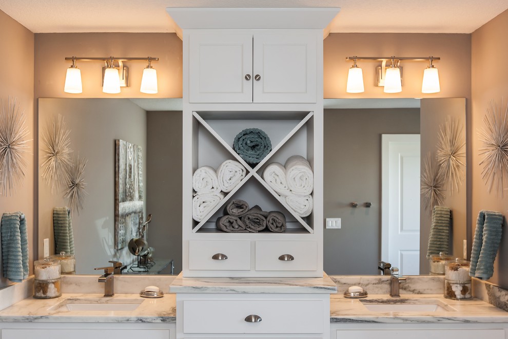 Mid-sized traditional master bathroom in Kansas City with recessed-panel cabinets, white cabinets, an alcove tub, a corner shower, a one-piece toilet, white tile, stone slab, beige walls, mosaic tile floors, a wall-mount sink and granite benchtops.