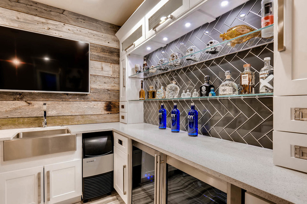 Inspiration for a mid-sized contemporary u-shaped wet bar in Denver with an undermount sink, shaker cabinets, white cabinets, quartz benchtops, brown splashback, timber splashback, ceramic floors, grey floor and white benchtop.