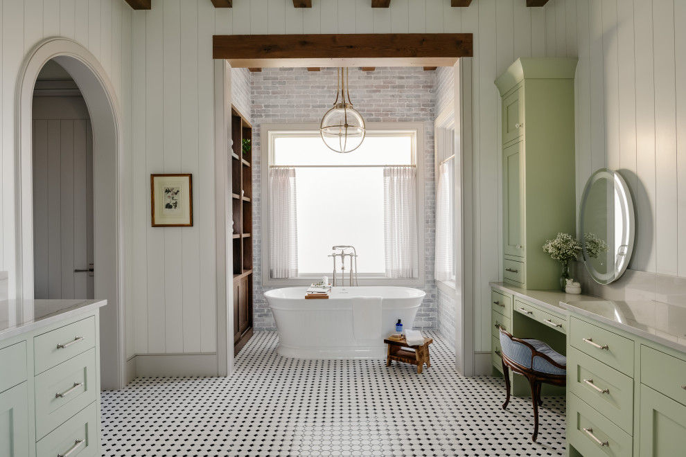 Country bathroom in Salt Lake City with shaker cabinets, green cabinets, a freestanding tub, white walls, mosaic tile floors, multi-coloured floor, grey benchtops, a built-in vanity, exposed beam, brick walls and planked wall panelling.
