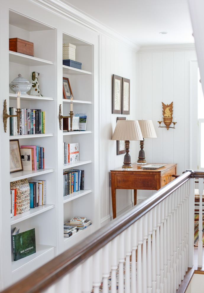 Hallway - traditional light wood floor and brown floor hallway idea in Jacksonville with white walls