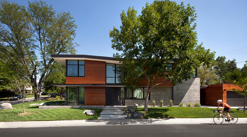 Inspiration for a contemporary two-storey exterior in Denver with mixed siding.
